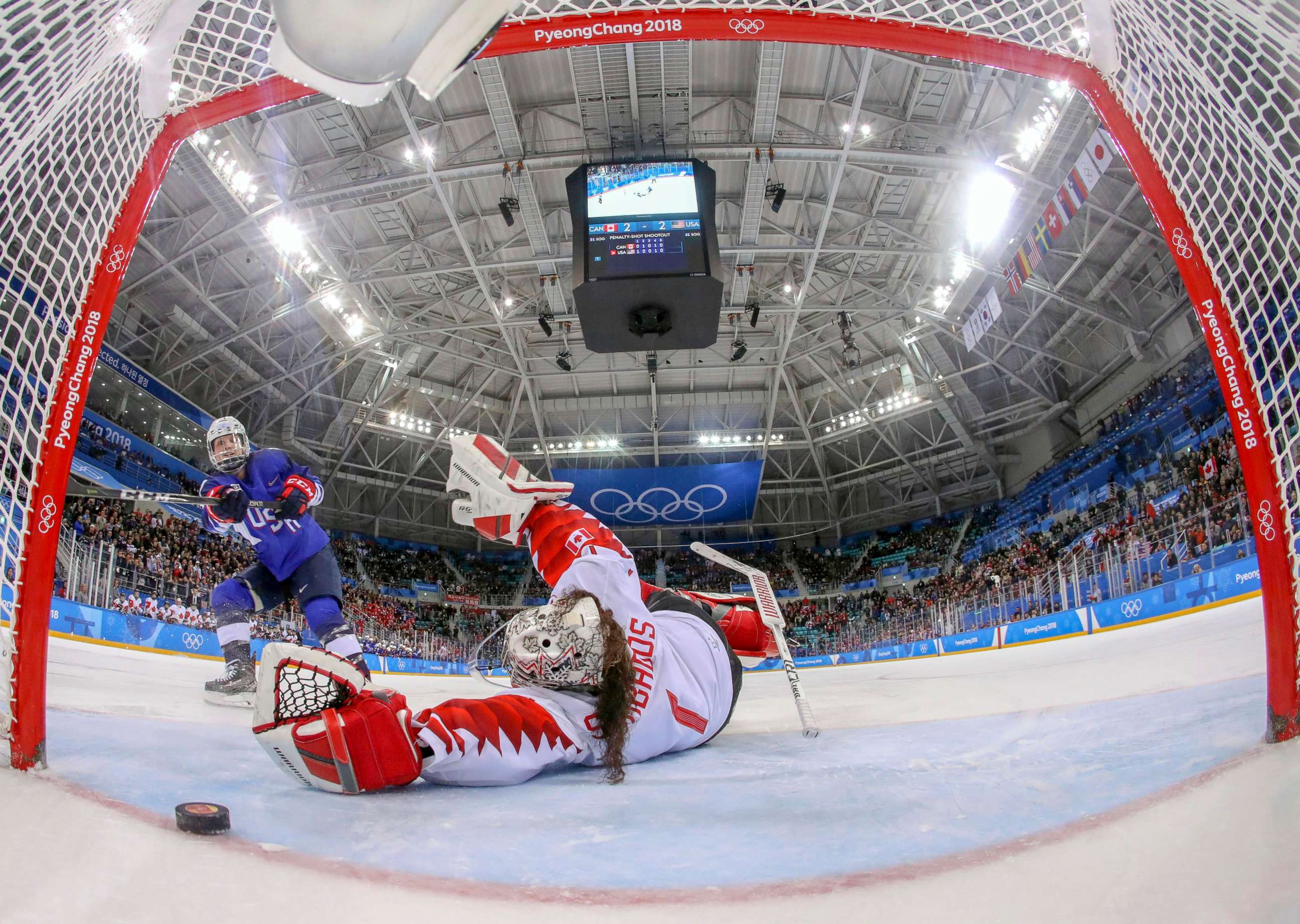 PHOTO: American Jocelyne Lamoureux-Davidson scores a game winning goal against goalie Shannon Szabados  of Canada, in the penalty shootout during the women's gold medal hockey game, Feb. 22, 2018. 