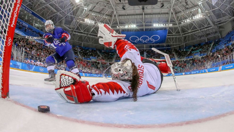 PHOTO: American Jocelyne Lamoureux-Davidson scores a game winning goal against goalie Shannon Szabados  of Canada, in the penalty shootout during the women's gold medal hockey game, Feb. 22, 2018. 