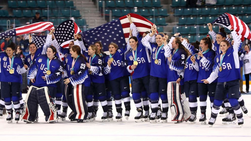 Members of the United States women's hockey team celebrate having won the gold medal after defeating Canada in a shootout, Feb. 22, 2018.  
