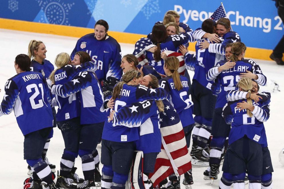 PHOTO: Members of the The United States women's hockey team celebrate after defeating Canada 3-2 in a shootout to win the gold medal game, Feb. 22, 2018.