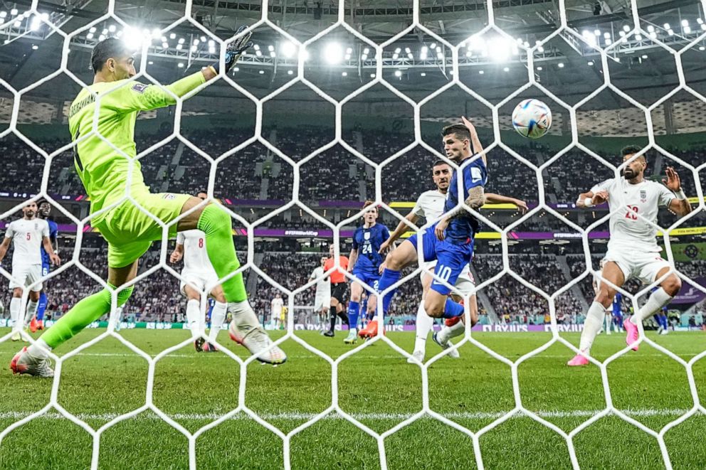 PHOTO: Christian Pulisic of the United States scores his side's opening goal during the World Cup group B soccer match between Iran and the United States at the Al Thumama Stadium in Doha, Qatar, Tuesday, Nov. 29, 2022