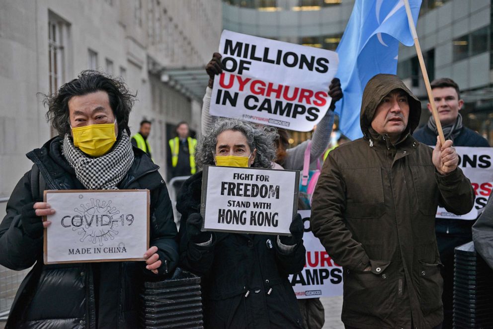 PHOTO: Activists hold placards calling for the BBC to boycott the Beijing 2022 Olympic Games, on Jan. 4, 2022, in London.