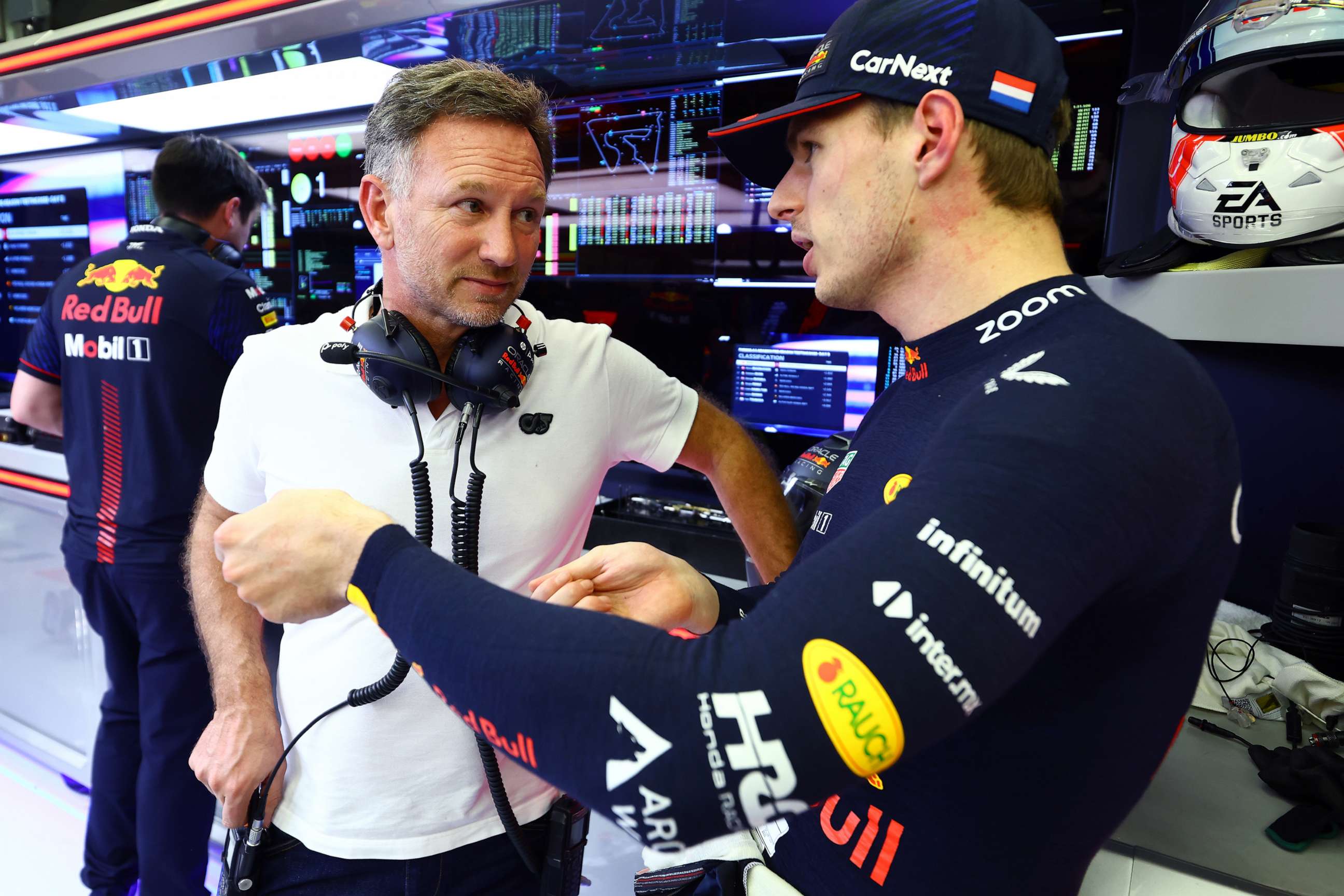 PHOTO: Red Bull Racing Team Principal Christian Horner talks with Max Verstappen of the Netherlands and Oracle Red Bull Racing during day two of F1 Testing at Bahrain International Circuit on Feb. 24, 2023 in Bahrain, Bahrain.