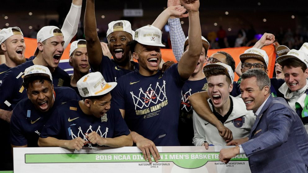 PHOTO: Virginia head coach Tony Bennett celebrates with his team after defeating Texas Tech 85-77 in the overtime in the championship of the Final Four NCAA college basketball tournament, Monday, April 8, 2019, in Minneapolis.
