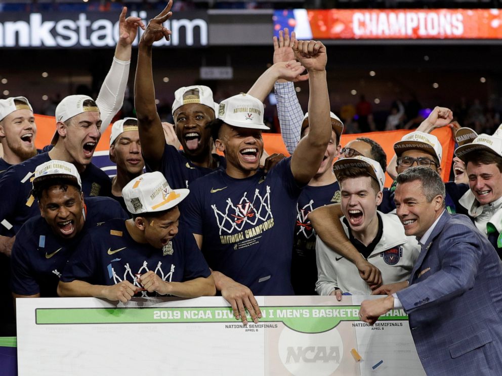 PHOTO: Virginia head coach Tony Bennett celebrates with his team after defeating Texas Tech 85-77 in the overtime in the championship of the Final Four NCAA college basketball tournament, Monday, April 8, 2019, in Minneapolis.