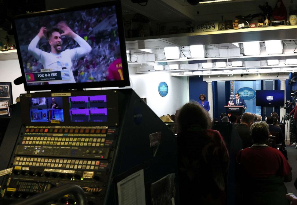 PHOTO: John Kirby, coordinator for strategic communications at the National Security Council, speaks alongside White House press secretary Karine Jean-Pierre as a World Cup game is displayed on a television, on Nov. 28, 2022, in Washington, D.C.