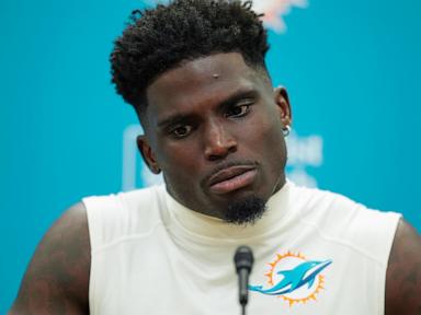 Tyreek Hill smiles and waves as he arrives at Hard Rock Stadium for Dolphins' game against Bills