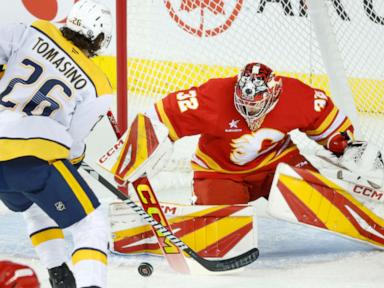 Wolf makes 29 saves for first career shutout as Flames beat Predators 2-0