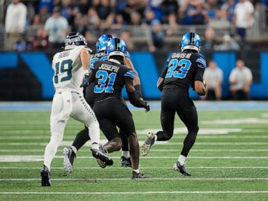 Jared Goff makes 1st NFL TD reception and throws for 2 TDs in Lions' 42-29 win over Seahawks