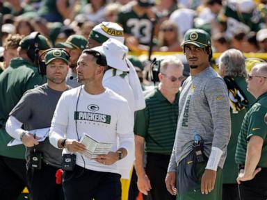 Warm day at Lambeau Field puts heat on Packers' O-linemen and causes one to vomit on football