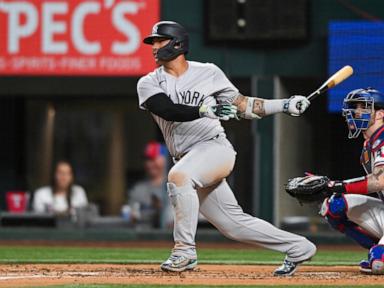 Stanton reaches 25 homers for 10th time and Cole exits with cramp as Yankees beat Texas 8-4