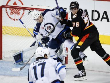 Unbeaten Jets defeat Flames 5-3, extending win streak to 8 straight