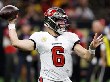 Mayfield passes for 4 TDs as the Bucs treat storm-weary fans to a 51-27 win over the Saints