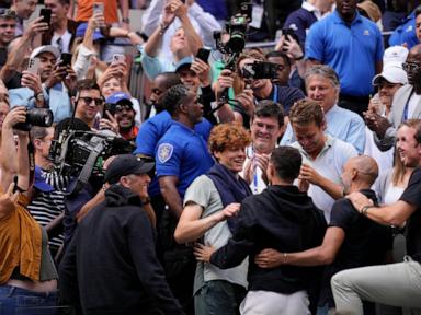 Jannik Sinner gets a hug from his friend Seal after winning the US Open title