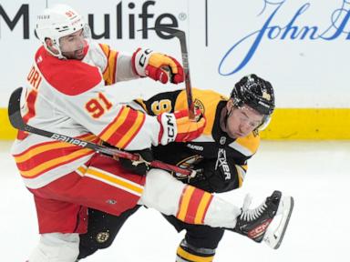 Brad Marchand scores OT goal to lead Bruins to 4-3 victory over Flames