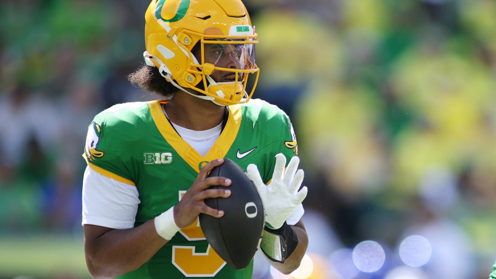 Moore throws for 3 TDs and No. 2 Oregon overcomes a slow start to beat Boise State 34-27