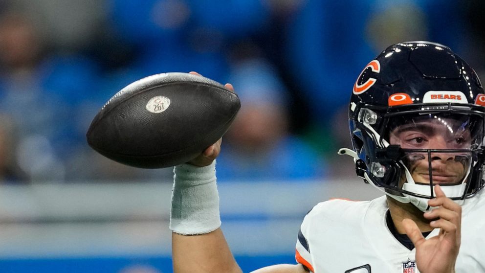 Chicago Bears quarterback Justin Fields (1) throws during the second half of an NFL football game against the Detroit Lions, Sunday, Jan. 1, 2023, in Detroit. (AP Photo/Paul Sancya)