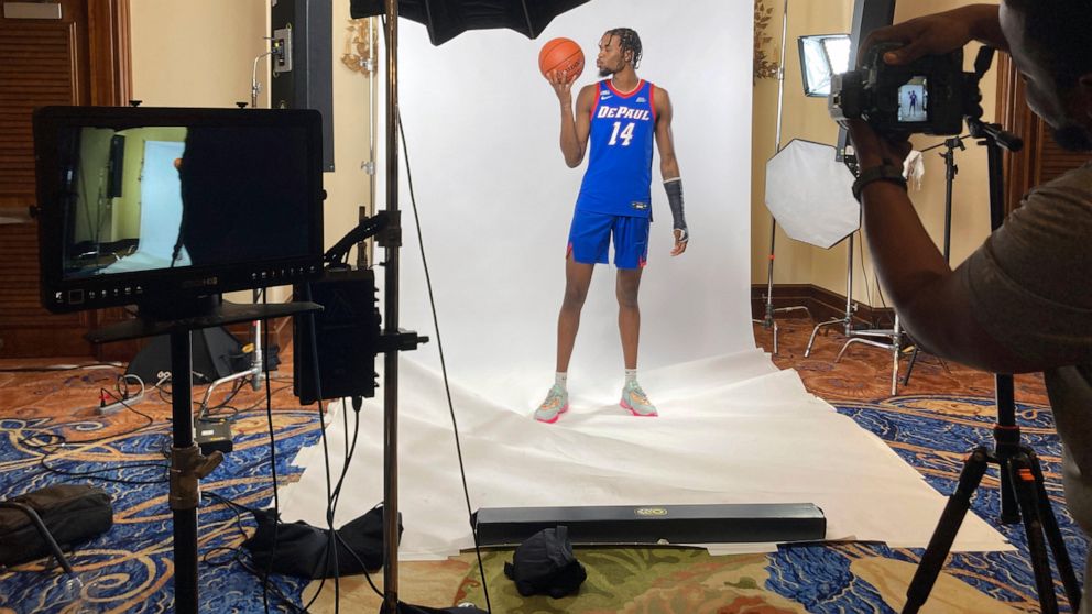 DePaul's Nick Ongenda, of Canada, poses for photos in Paradise Island, Bahamas, Nov. 19, 2022. College athletes from foreign countries have been left out of the rush for endorsement deals because student visa rules largely prohibit work while in the 