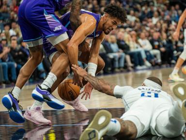 John Collins scores on a late dunk to lift Jazz past Mavericks for 1st home victory