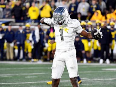 Dillon Gabriel throws a TD pass and runs for a score to lead No. 1 Oregon to 38-17 win over Michigan