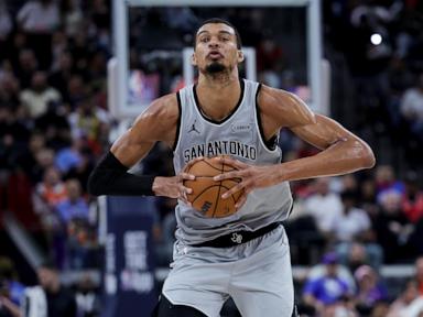 Wembanyama powers Spurs past Clippers 119-115 after wild swings and a late scare to reach 50 wins