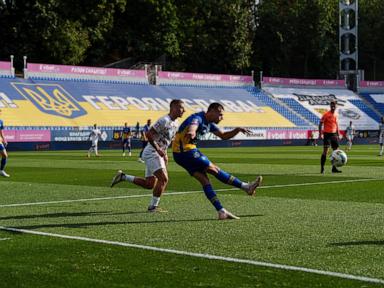 In wartime Ukraine, soccer fans bury rivalries and find a moment of calm at matches