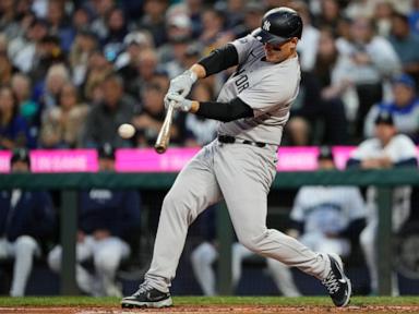 Yankees clinch playoff berth by beating Mariners 2-1 in 10 innings