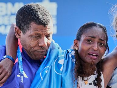 Cramps derail Tigst Assefa's world record as Guye Adola wins Berlin Marathon