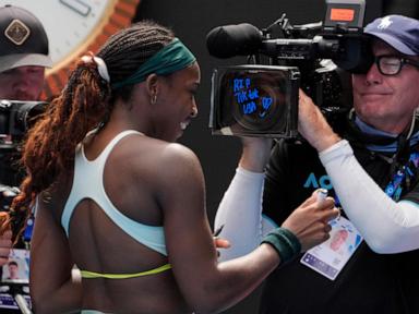 Coco Gauff writes 'RIP TikTok USA' on a TV camera at the Australian Open