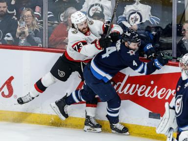 Connor Hellebuyck makes 33 saves in the NHL-leading Jets' 4-2 victory over the Senators