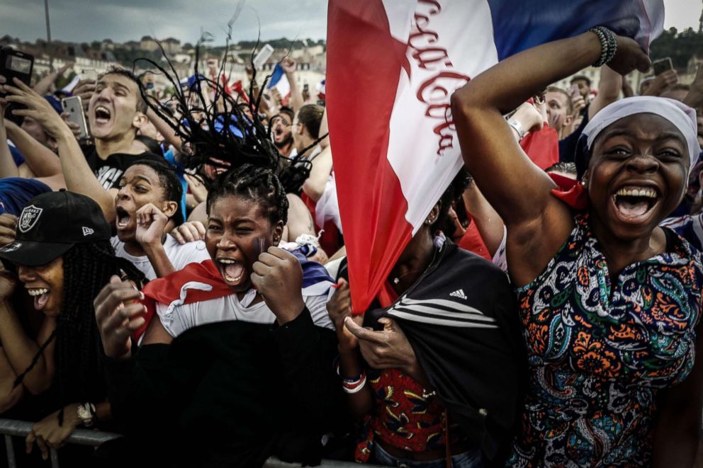   PHOTO: People react by watching the final match of the 2018 Russia World Cup between France and Croatia on July 15, 2018 in Lyon, France 