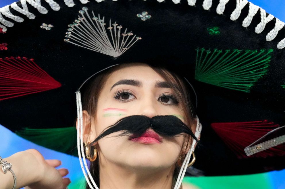 PHOTO: A fan of the team form Mexico watches during warm ups before the World Cup group C soccer match between Mexico and Poland, at the Stadium 974 in Doha, Qatar, Tuesday, Nov. 22, 2022. 