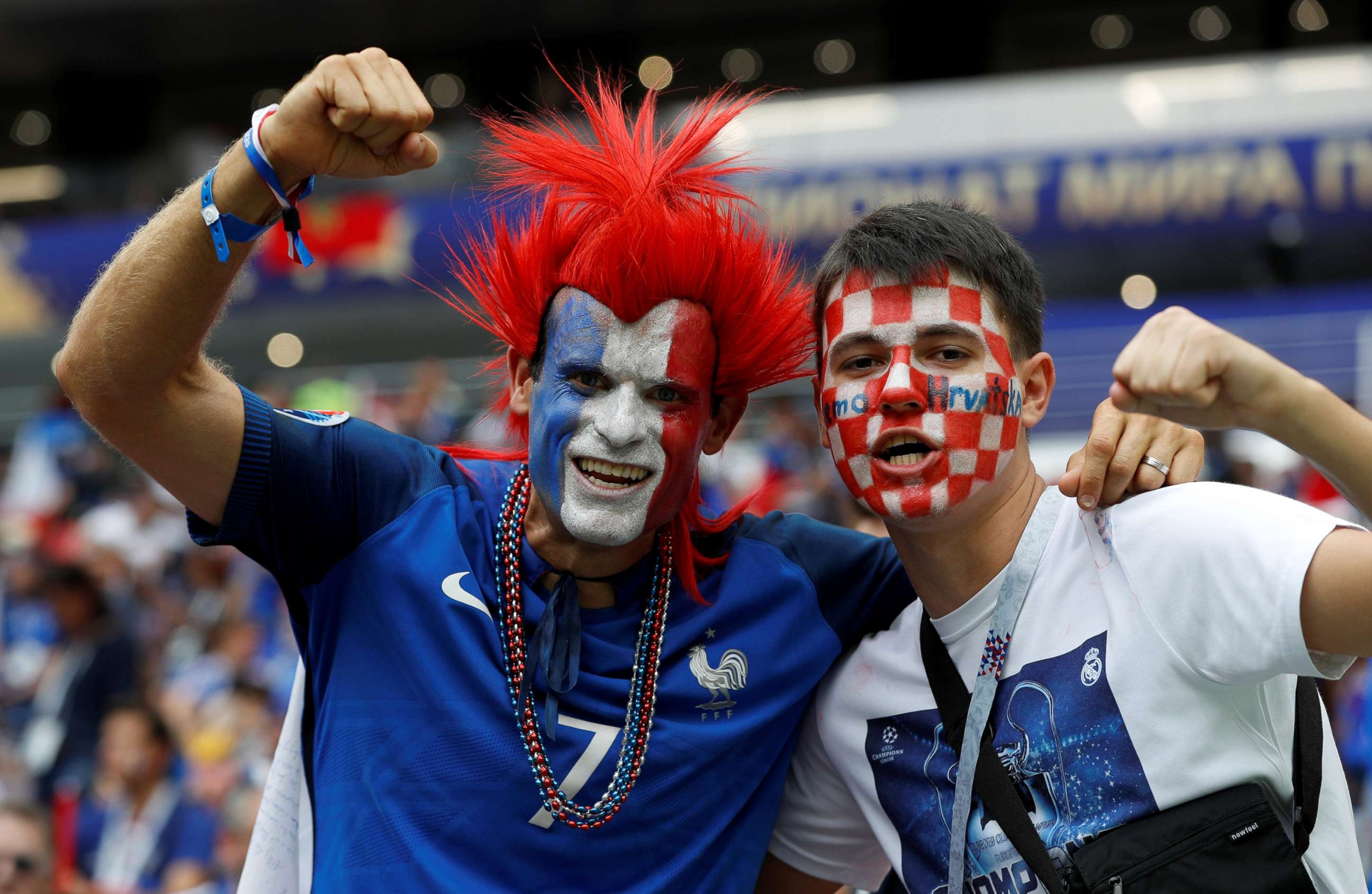 PHOTO: A France fan and a Croatia fan pose for a photo inside Luzhniki Stadium before the World Cup match in Moscow, July 15, 2018.