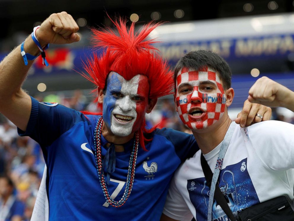 PHOTO: A France fan and a Croatia fan pose for a photo inside Luzhniki Stadium before the World Cup match in Moscow, July 15, 2018.
