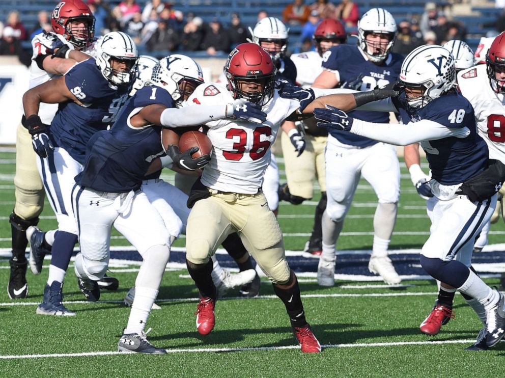 PHOTO: In this Nov. 23, 2019, file photo, Harvard's Devin Darrington runs against Yale during the first half of an NCAA college football game in New Haven, Conn. 
