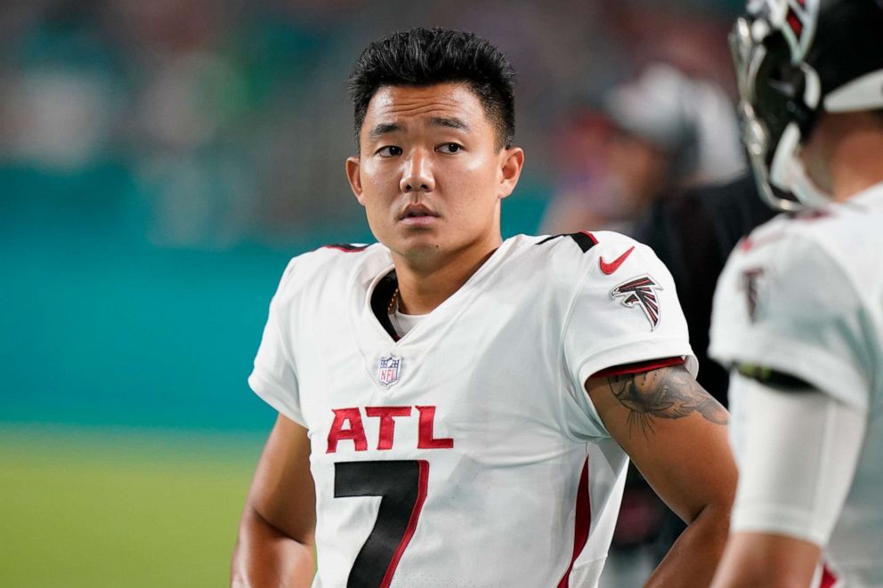 PHOTO: Atlanta Falcons kicker Younghoe Koo stands on the field during the second half of a preseason NFL football game against the Miami Dolphins, Aug. 21, 2021, in Miami Gardens, Fla.