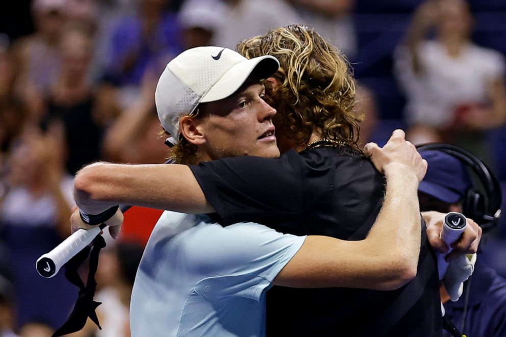 PHOTO: Jannik Sinner, of Italy, hugs Alexander Zverev, of Germany, after Zverev won their match during the fourth round of the U.S. Open tennis championships in New York, New York, on Sept. 5, 2023.