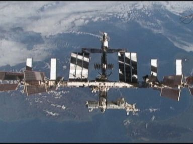 VIDEO: NASA authorities believe a sensor gave a false alarm, prompting U.S. astronauts to evacuate to the space station's Russian sector.