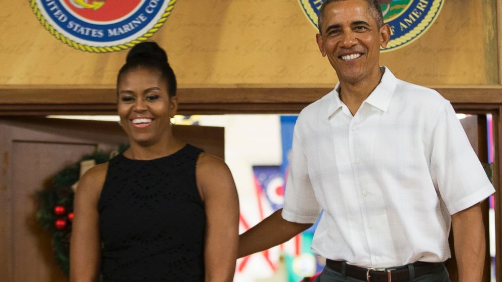 Michelle Obama and President Barack Obama arrive for an event to thank service members and their families at Marine Corp Base Hawaii,  Dec. 25, 2015, in Kaneohe Bay, Hawaii.  