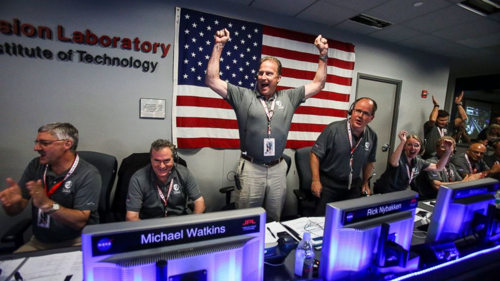 PHOTO: From left to right, Geoffrey Yoder, Michael Watkins, Rick Nybakken, Richard Cook and Jan Chodas celebrate in Mission Control at NASA's Jet Propulsion Laboratory as Juno goes into orbit around Jupiter on July 4, 2016, in Pasadena, California.