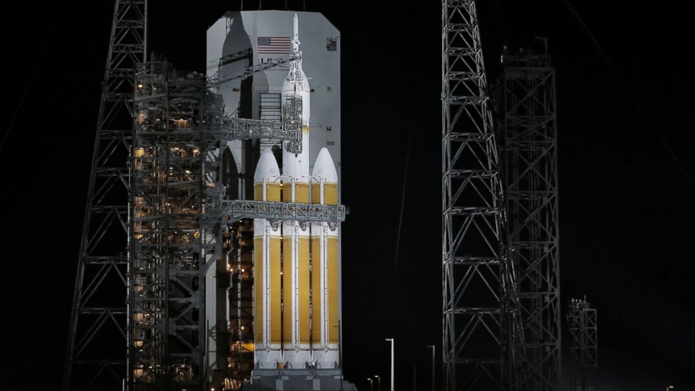 PHOTO: The service structure is rolled away from NASA's Orion spaceship, Dec. 4, 2014, in Cape Canaveral, Fla.