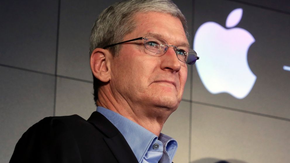 Apple CEO Tim Cook listens to questions during a news conference at IBM Watson headquarters, in New York, April 30, 2015.