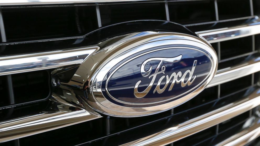 PHOTO: The Ford blue oval badge is seen in the grill of a 2015 Ford F-150 XLT.