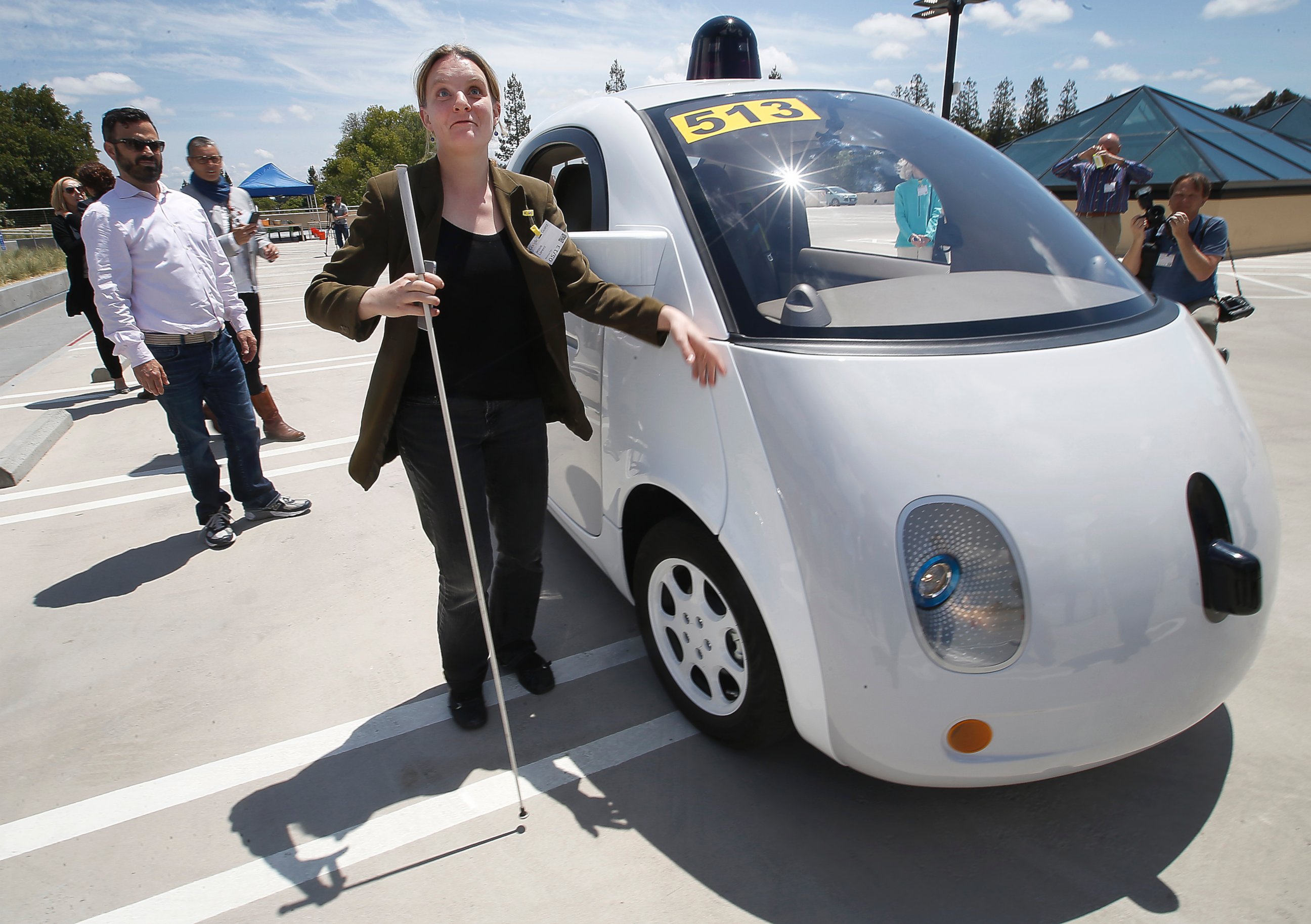 PHOTO: Jessie Lorenz, of San Francisco, touches the new Google self-driving prototype car during a demonstration at the Google campus in Mountain View, Calif.