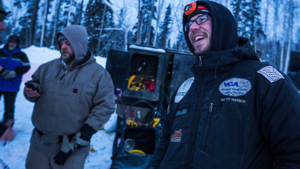 Musher Brent Sass, right, relaxes after arriving in Fairbanks for the start of the Iditarod Trail Sled Dog Race in Fairbanks, Alaska, March 9, 2015.