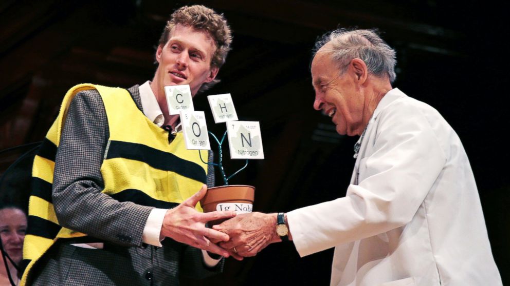 PHOTO: Michael Smith, left, accepts his trophy from Dudley Herschbach, the 1986 Nobel Laureate in Chemistry, while being honored during a performance at the Ig Nobel Prize ceremony at Harvard University, in Cambridge, Mass., Sept. 17, 2015. 