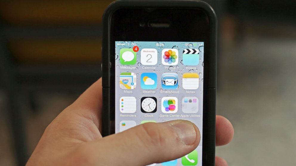 An iPhone is pictured in this file photo demonstrating Apple's news that new software will allow users to control certain features in their home directly from their iPhone. 