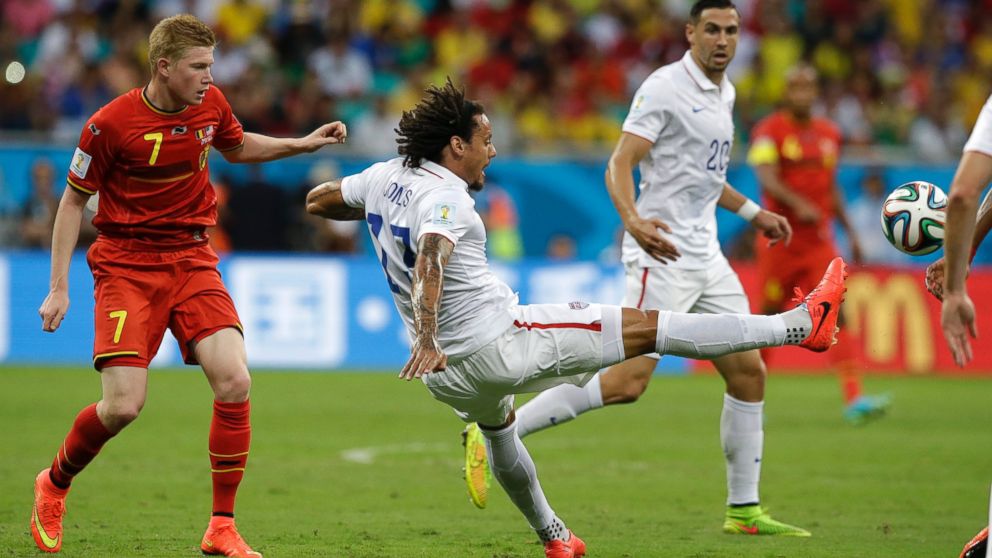 United States' Jermaine Jones, right, clears the ball from Belgium's Kevin De Bruyne during the World Cup round of 16 soccer match between Belgium and the U.S. at the Arena Fonte Nova in Salvador, Brazil, July 1, 2014.