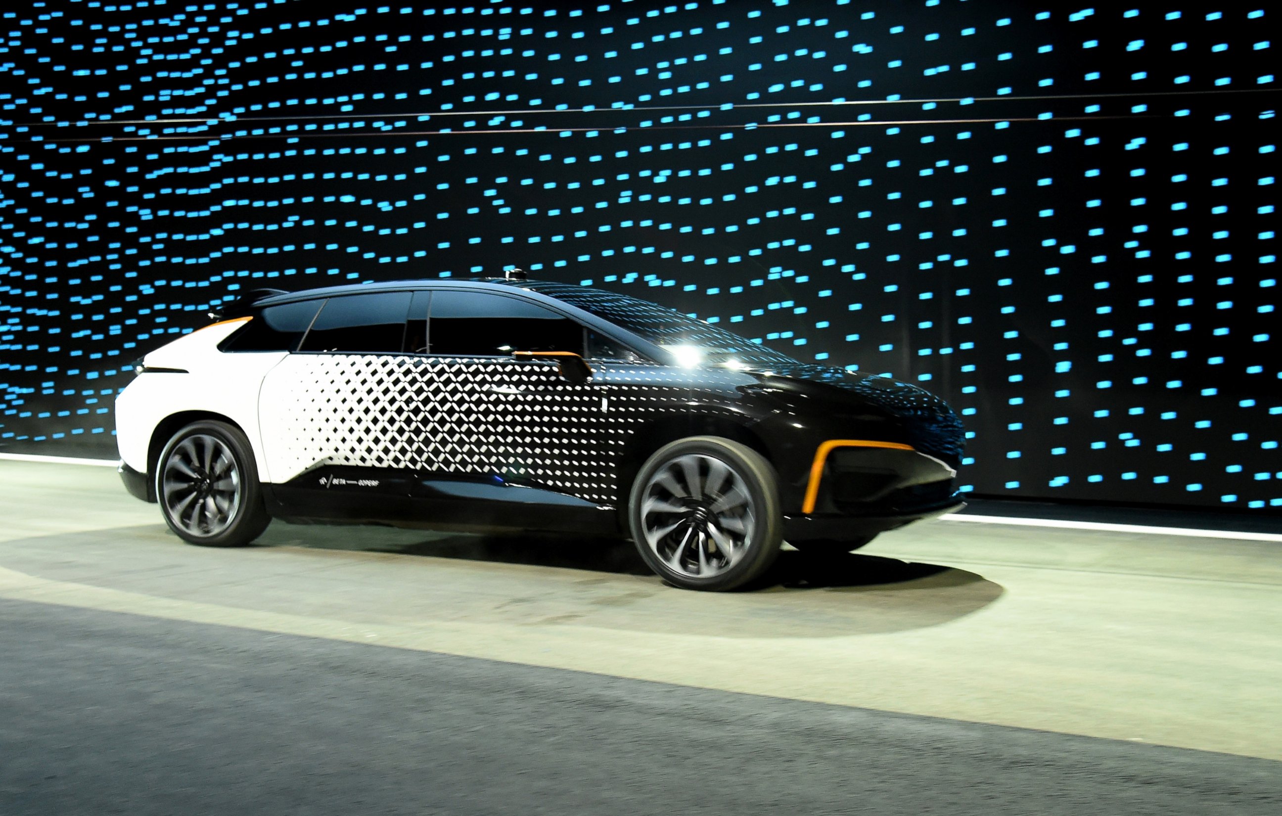 PHOTO: Faraday Future's FF 91 prototype electric crossover vehicle is shown during a speed test as it is unveiled during a press event for CES 2017 at The Pavilions at Las Vegas Market, Jan. 3, 2017 in Las Vegas. 
