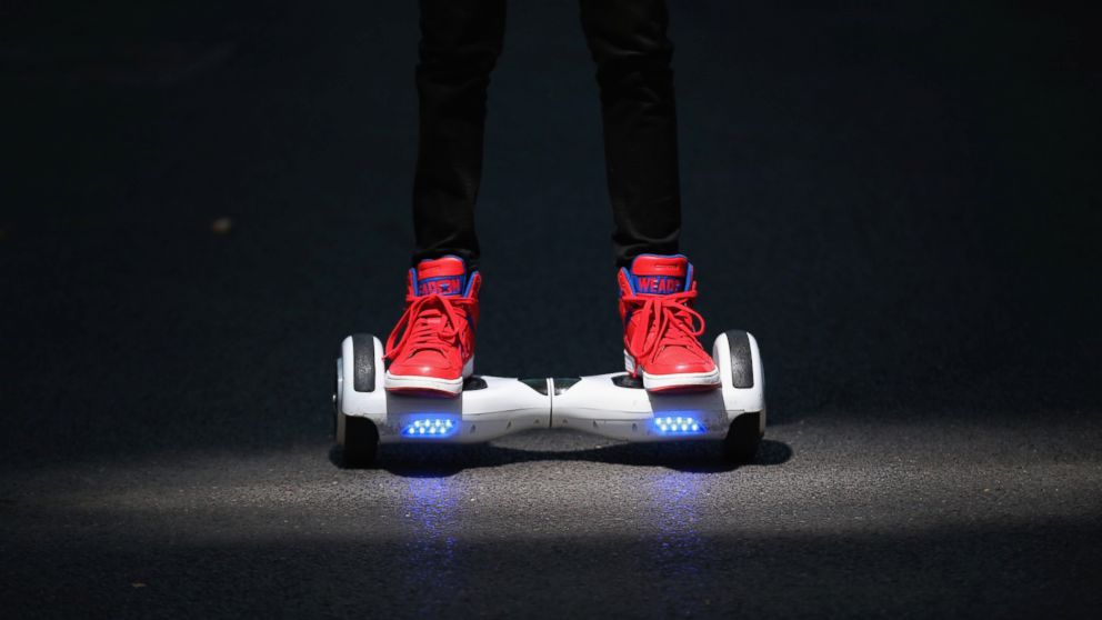A youth poses as he rides a hoverboard, Oct. 13, 2015, in Knutsford, England.  